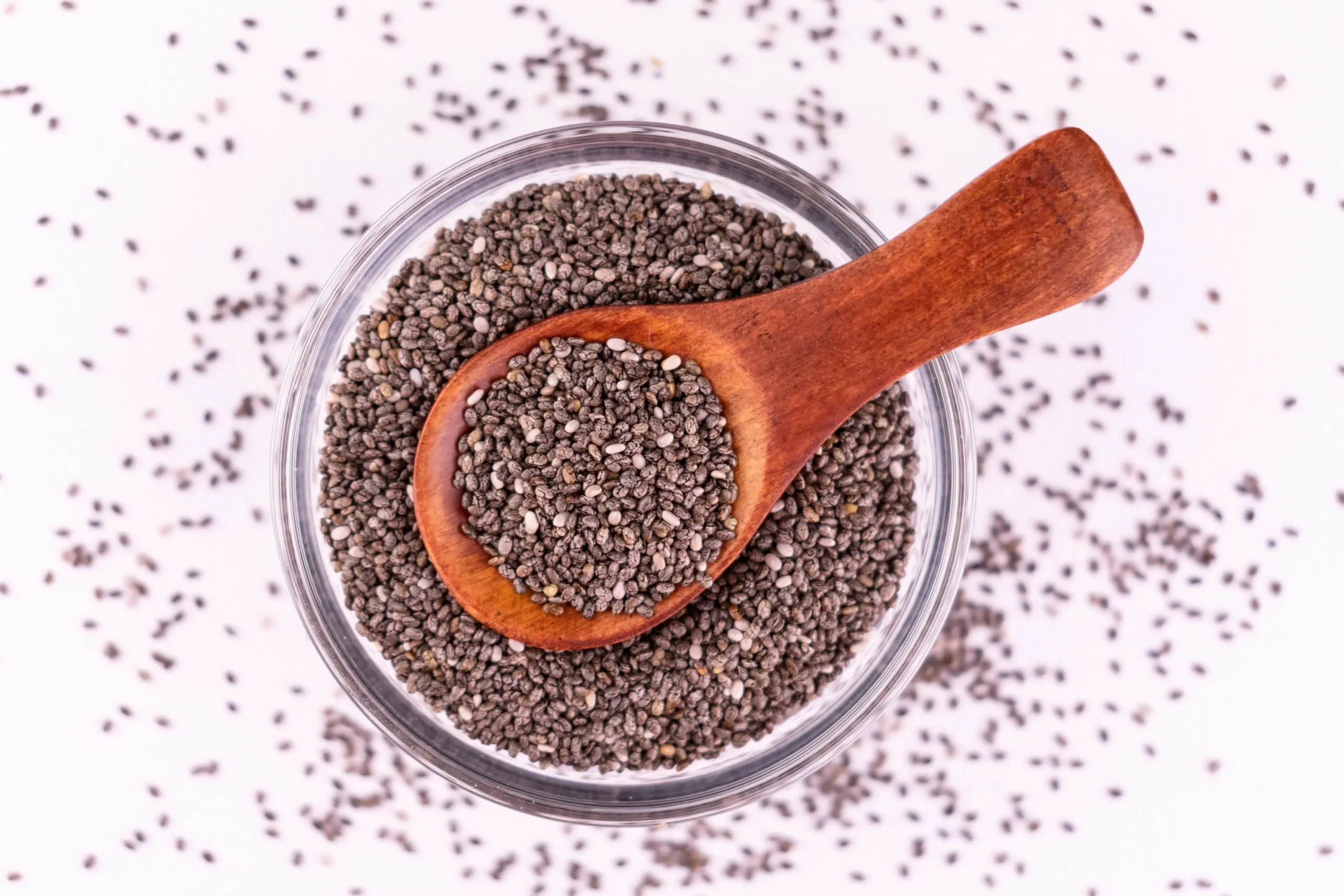 chia seeds plate white background flat lay scaled