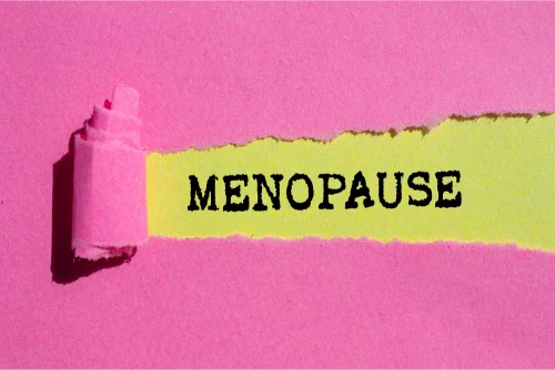 a close-up of a pink paper with a black text